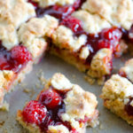 Apple Butter Cherry Cobbler Bars - These cherry cobbler bars have added depth of flavor with a secret ingredient. Simple and sweet with cherry pie filling and the great, unique taste of Musselman's Apple Butter.